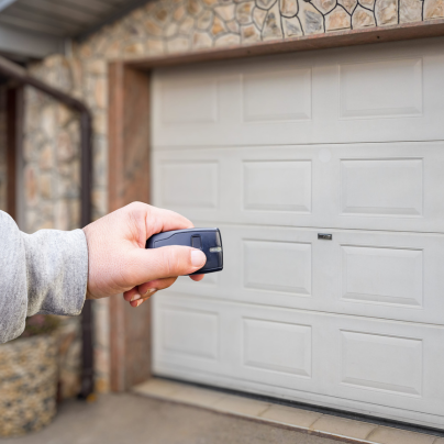 Ventura security key fob pointing to a garage door