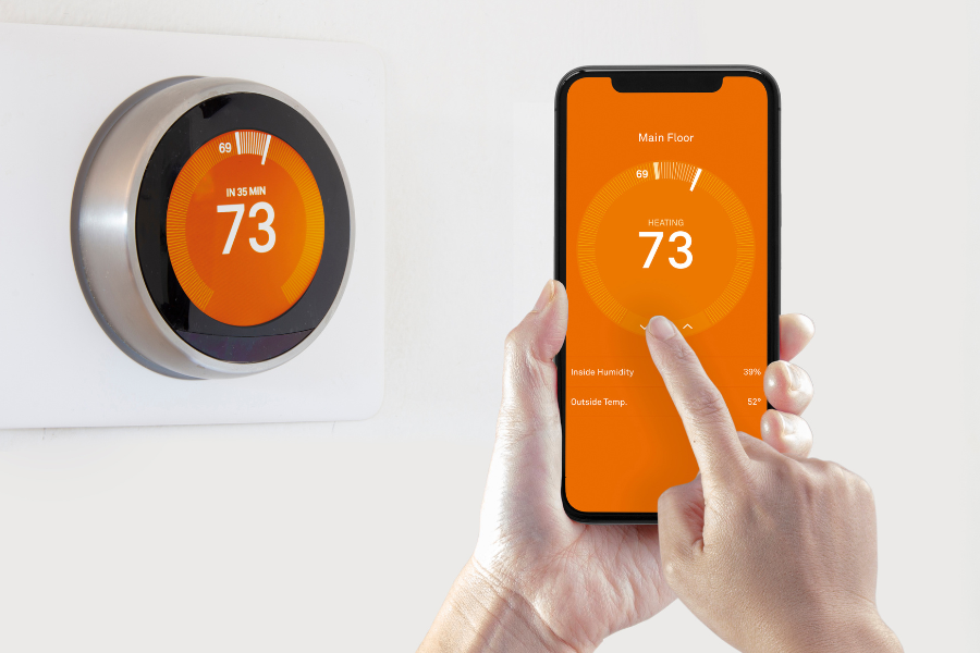 smart thermostat and close up thermostat mobile screen display